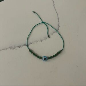 Green Beaded Bracelet with Blue Accent
